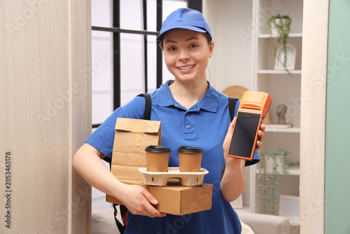 Smiling female delivery per...