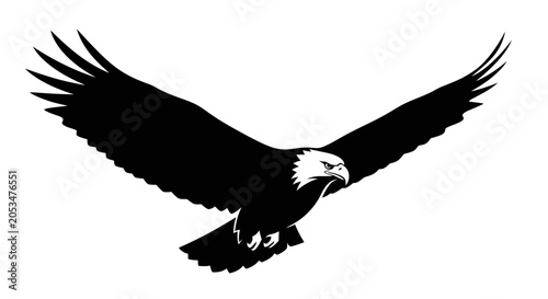 Black silhouette of a majestic eagle in flight, symbolizing freedom and power
