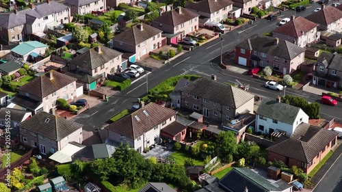 Aerial close up of a residential housing estate in Penrith Cumbria England showing detached and semi detached family homes private gardens driveways quiet suburban streets and neighbourhood living