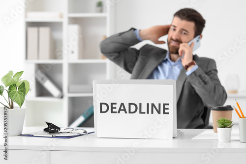 Businessman on phone with d...