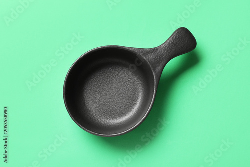 Empty black ceramic sauce d...
