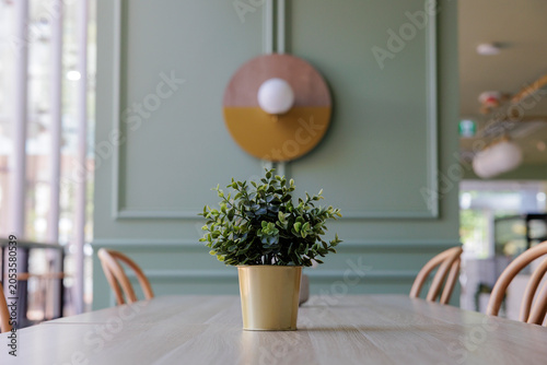 Stylish Cafe Interior with Bright Green Wall and Modern Design