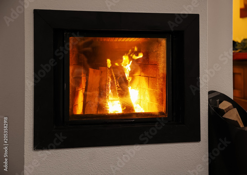 Cozy home fireplace with bu...