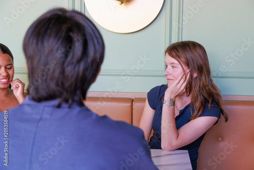 Young Students Socializing at Cafe During Study Break