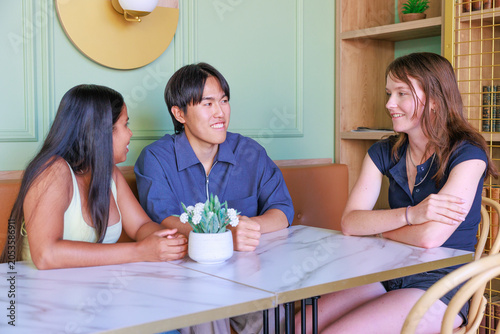 International University Students Chatting in a Cafe