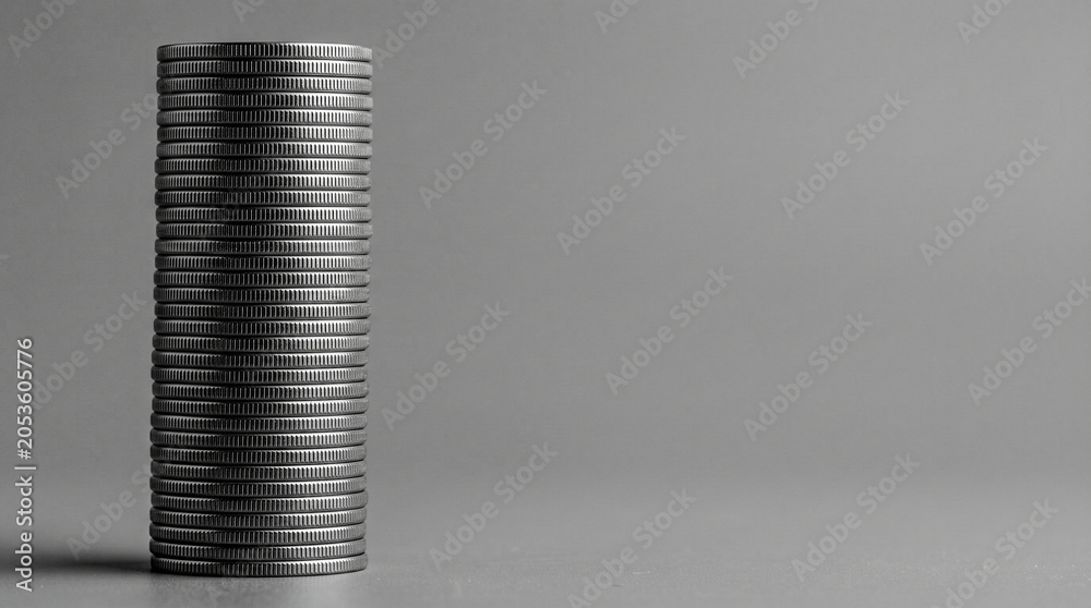 Fototapeta premium Desaturated coin stack side view milled edge texture, ash grey mono minimalism