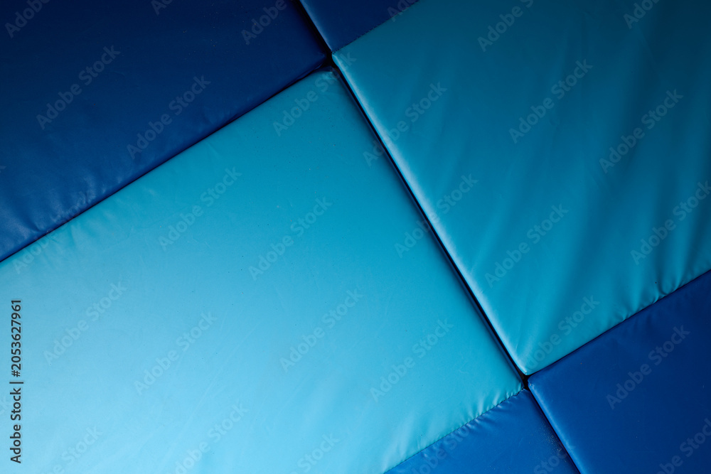 Naklejka premium Close up of a blue mat in a gym
