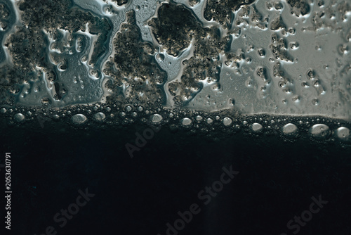 Macro Bubbles in Liquid with Grunge Grey Color Grading Abstract Background