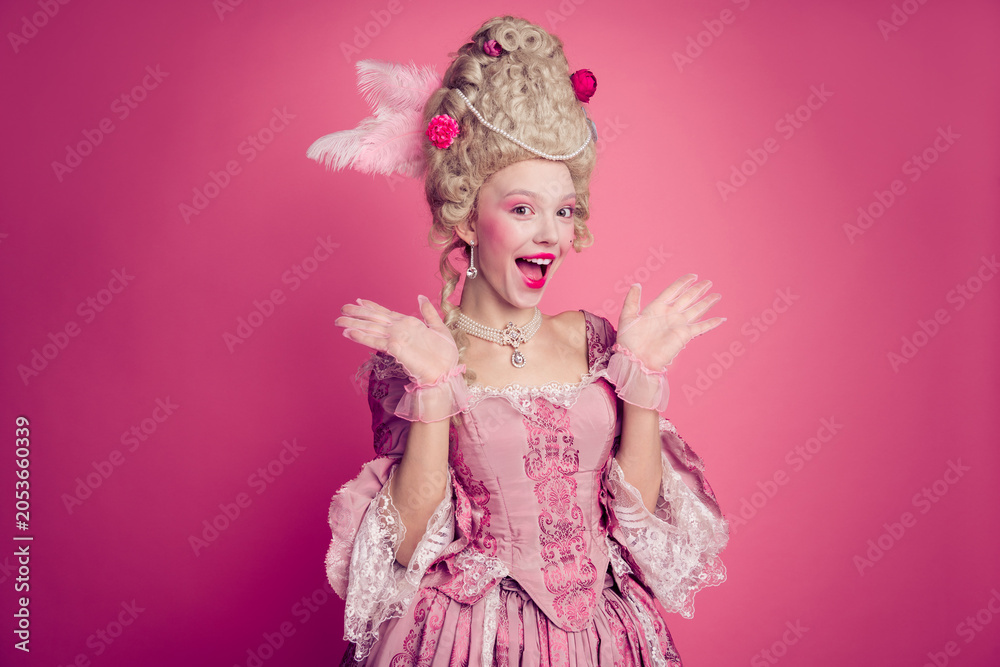 Fototapeta premium Photo of shock surprise lady princess feel impressed wearing festive antique style dress isolated pink color background