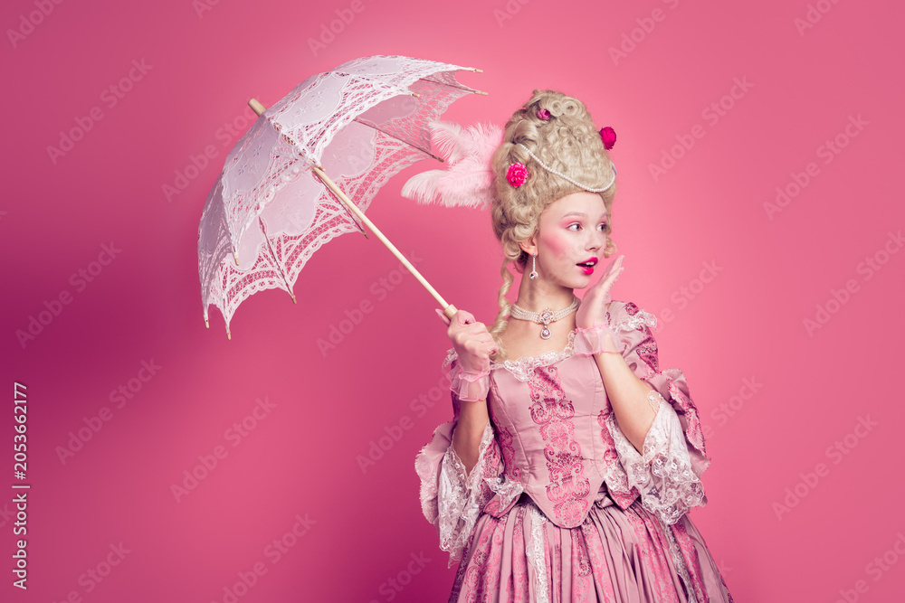 Fototapeta premium Photo of charming impressed marie antoinette wear rich dress rising umbrella looking empty space isolated pink color background