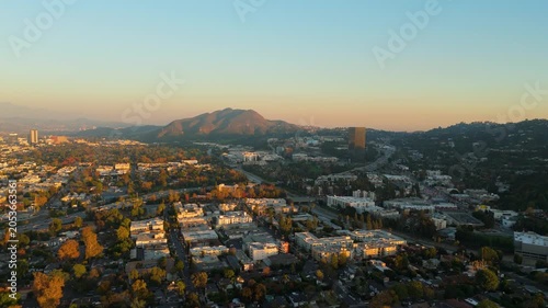 Aerial view of Studio City neighborhood with hills and residential area at sunset