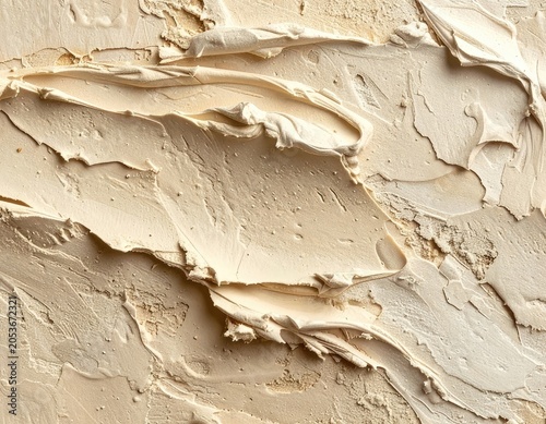 Thick, creamy, textured light beige paint strokes creating abstract patterns