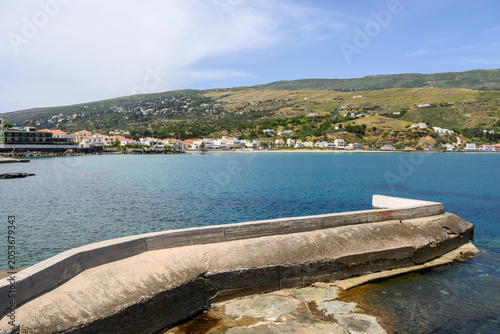 A bay with a beach near the town of Chora on the island of Andros. Cyclades, Greece
