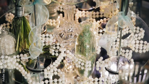 The festive table is decorated with beads, a mirror stand and other decor. Close-up shooting
