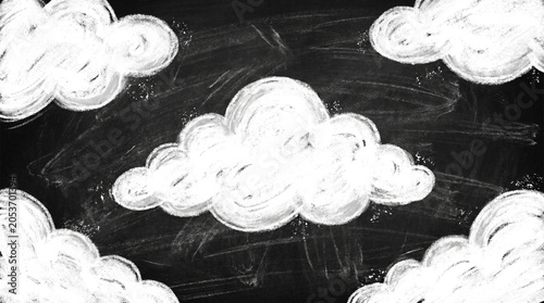 Chalky white cloud sketches on a blackboard background conveying imagination, ideas, education and creativity. Hand-drawn doodles create a soft, textured sky motif ideal for presentations, banners