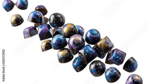 Many small round blue and gold chocolate candies falling and flying in the air