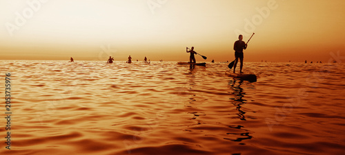 Photos black silhouette of group team figures swimming on a sup paddle board on horizon in summer
