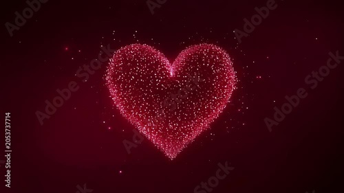 Volumetric red particle heart pulsating and shining softly against deep burgundy gradient background. Pure love and wedding celebration concept