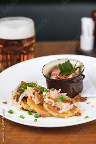 Quadro su tela Savory pancakes with beer in a restaurant