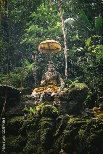Moss Covered Buddha Statue in Tropical Forest