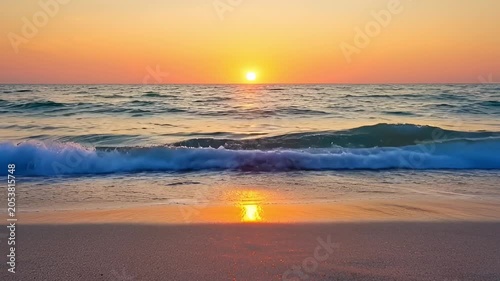 Ocean waves under a sunset sky with golden sunlight reflecting on water
