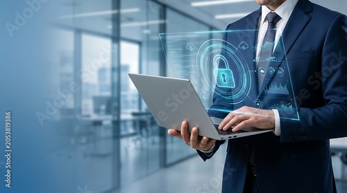 Businessman Holding Laptop with Glowing Digital Padlock Hologram for Corporate Cyber Security Strategy