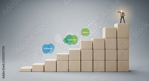 Businessman stands atop a staircase made of wooden blocks to represent professional achievement and strategic growth in a corporate environment.