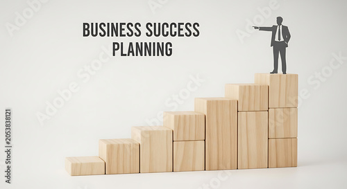 Businessman stands atop a set of wooden blocks representing a staircase to signify professional growth.