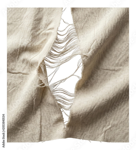 Close-up of a torn beige fabric with a central vertical rip and frayed hanging threads revealing a transparent background