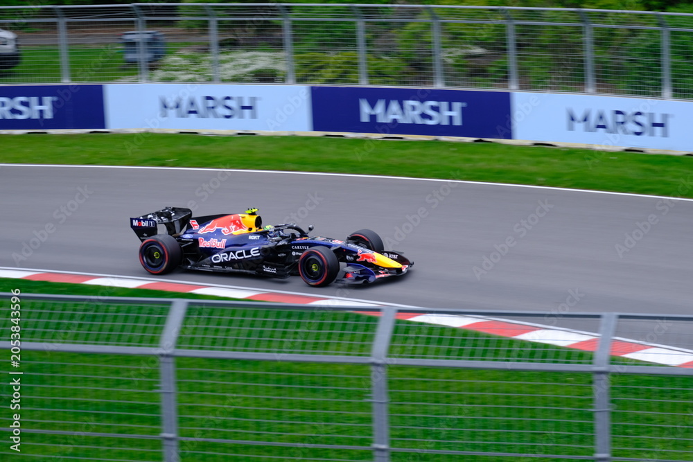 Obraz premium May 24, 2025, Montreal, Canada: Red Bull Racing Formula 1 car during by Hadjar or Verstappen, demonstration run at Circuit Gilles Villeneuve. g.