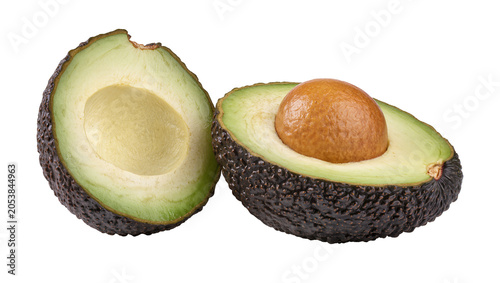 Cuadro en lienzo Ripe avocado halves with pit and seedless flesh