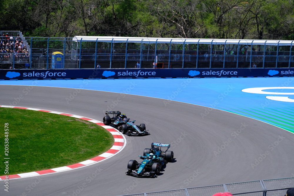 Naklejka premium May 24, 2026, Montreal, Canada, Mercedes F1 car racing through Circuit Gilles Villeneuve corner. g.