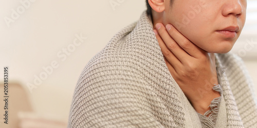 Bild auf Leinwand Asian man with sore throat pain and discomfort from illness for healthcare unwel