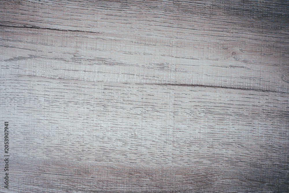 Fototapeta premium Light wood texture background with natural grain pattern and rustic surface. Wooden tabletop backdrop for product display, mockup, branding, advertising design, banner and copy space.