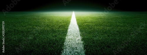 Illuminated Soccer Field Line Leading Towards Bright Light in Darkness.