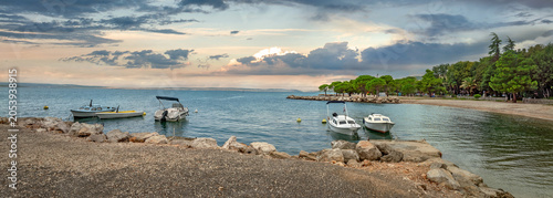 Panorama with coastline of Kvarner bay and moored boats near shore in Crikvenica town. Croatia