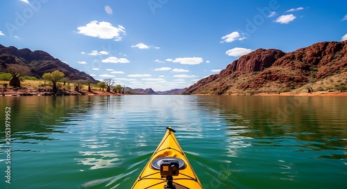 Kayaking Adventure on a Serene Lake Surrounded by Mountains.
