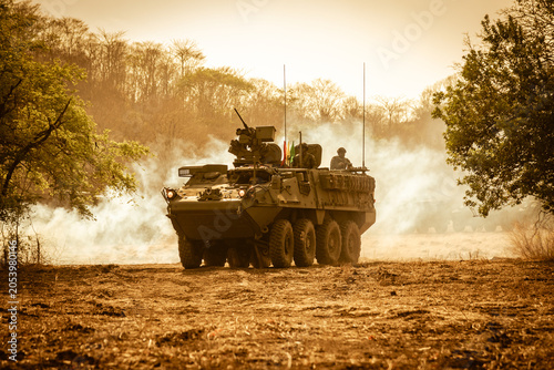 Bild auf Leinwand n eight-wheeled military armored personnel carrier (APC) moving fast on dry grou