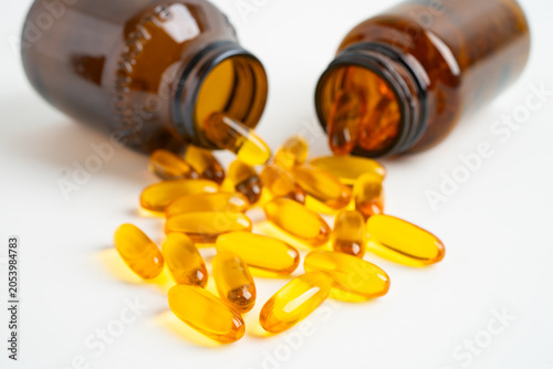 Fish oil or Cod liver oil gel in capsules with omega 3 vitamins, supplementary healthy food.