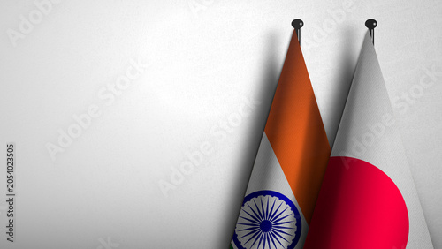 3D rendering of two flag from India and Japan on flagpoles with Gray background for diplomatic. bilateral relations. peace and conflict between countries. Fabric