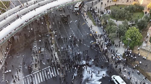 Aerial view Ultra Orthodox Protest Against Military Draft Jerusalem

Drone footage of ultra Orthodox protest near Chords Bridge, Cannon Dispersing Draft Protest Jerusalem, Israel, 1 June 2026.

