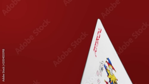 Joker Playing Card on Red Background Minimal Gambling Concept