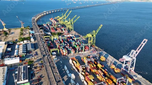 Aerial View of Docks Area Full of Containers in Rio de Janeiro City Port and The Bridge To Niteroi Crossing Guanabara Bay