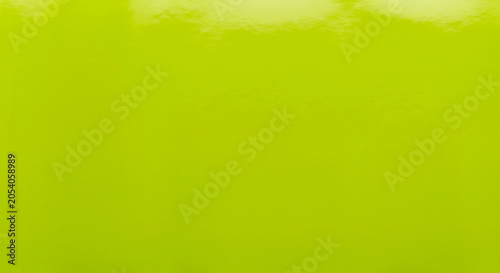 Smooth, soft green fabric texture with natural reflections.