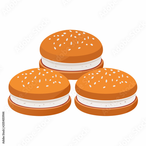 Three sweet buns with white cream filling and sesame seeds