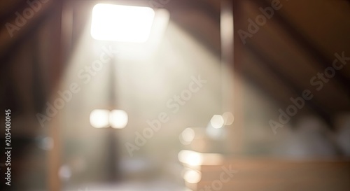 Sunlight streaming through a dusty attic window creating a hazy atmosphere.