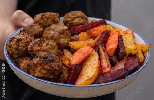 Bild auf Leinwand A healthy, balanced meal, minced meat cutlets and grilled vegetables, carrot and