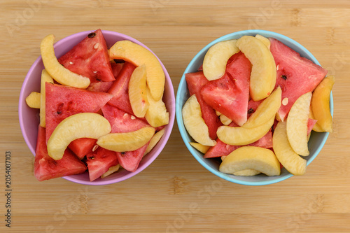 Cuadro en lienzo Fruit cut into pieces, watermelon and nectarines prepared for the party