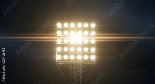 Bright stadium floodlights illuminating a dark background with lens flare effects