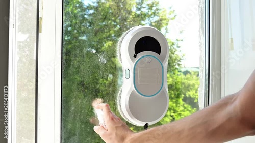 Automatic Window Cleaner with Spray Bottle in Action
